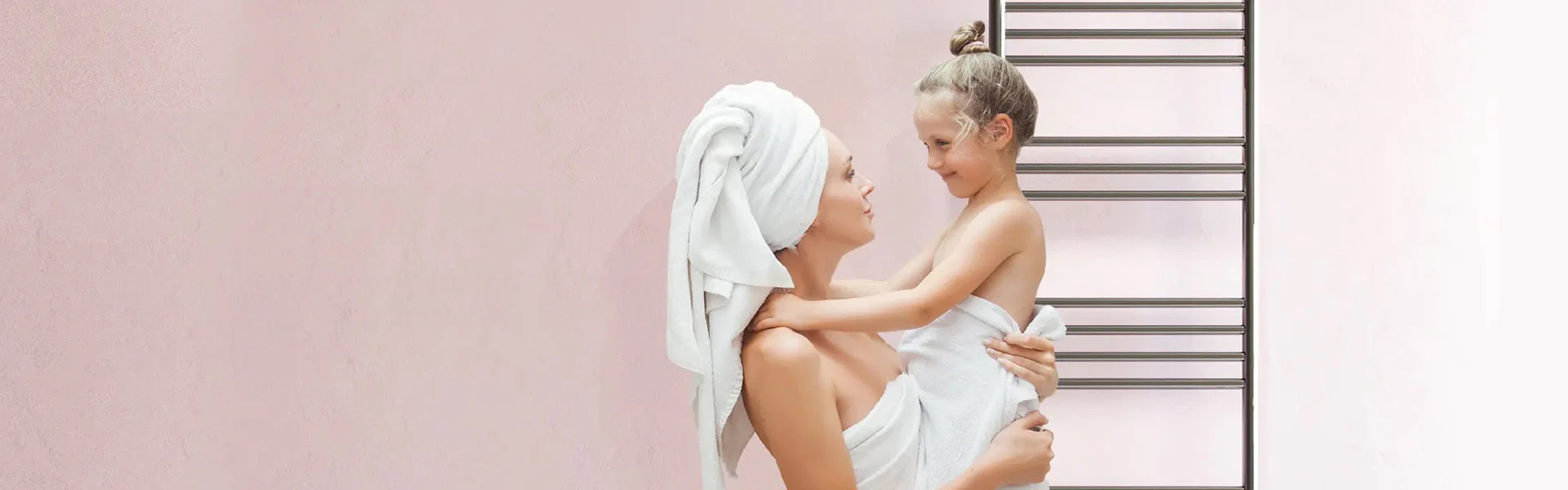 Bathroom Butler AUS home banner image - heated towel rail with lady and child