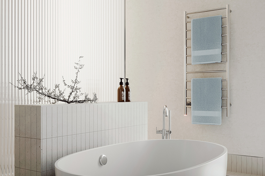 NATURAL 12 Bar heated towel rail in modern bathroom near freestanding bath
